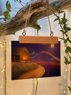 Postkarte "Kerze am Meer" | Eine weihnachtlich leuchtende Illustration.