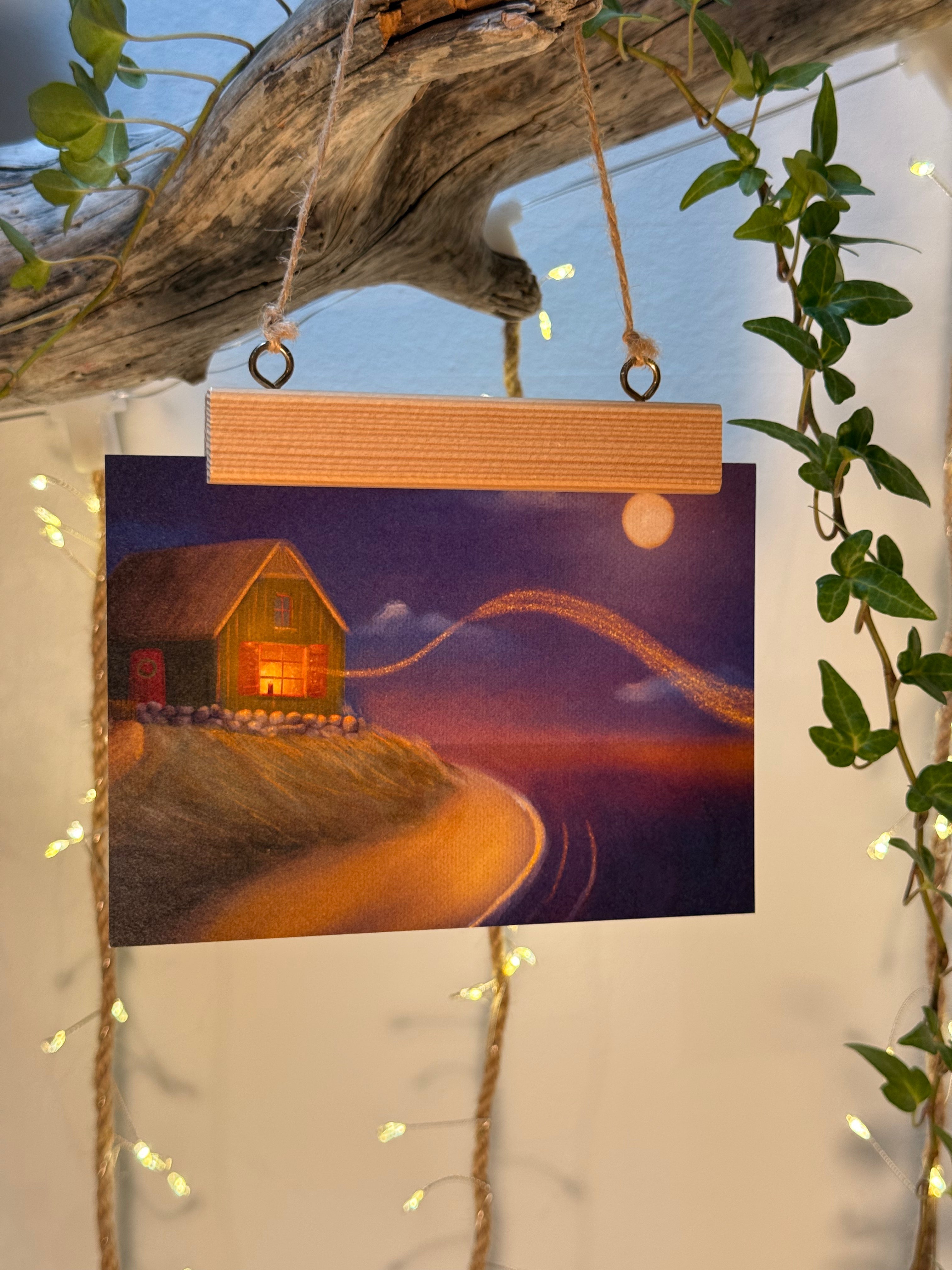 Postkarte "Kerze am Meer" | Eine weihnachtlich leuchtende Illustration.
