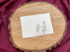 Postkarte „Dezembergefühle“ | eine besondere, liebevoll illustrierte Karte für alle, die Winter, Weihnachtsbäume und Fahrräder lieben.